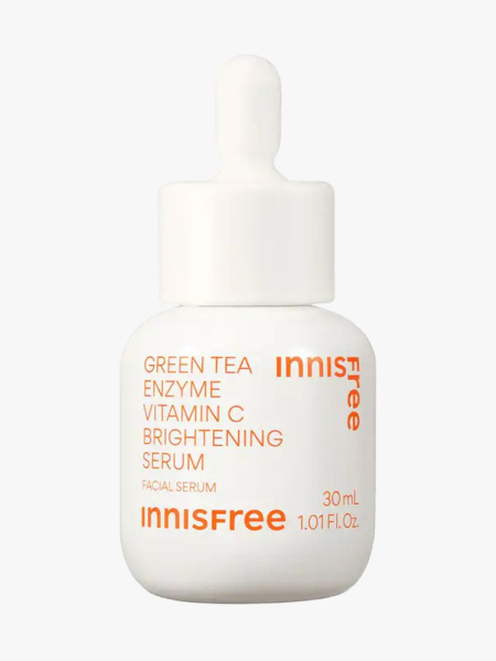 Innisfree Green Tea Enzyme Vitamin C Brightening Serum in branded component on a light gray ackground